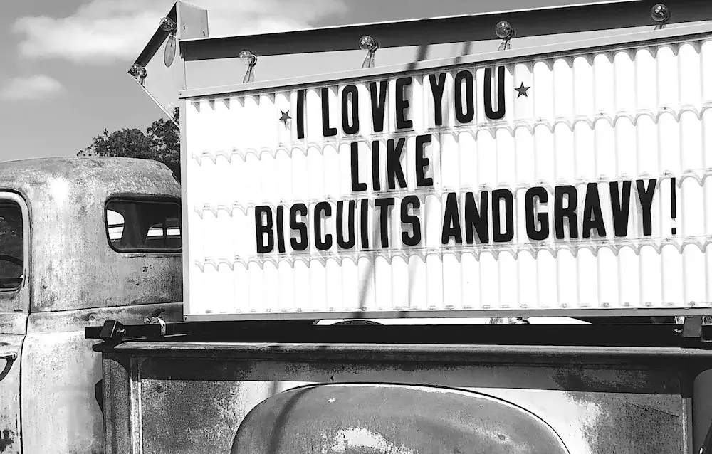 Vintage sign reading 'I Love Biscuits and Gravy'